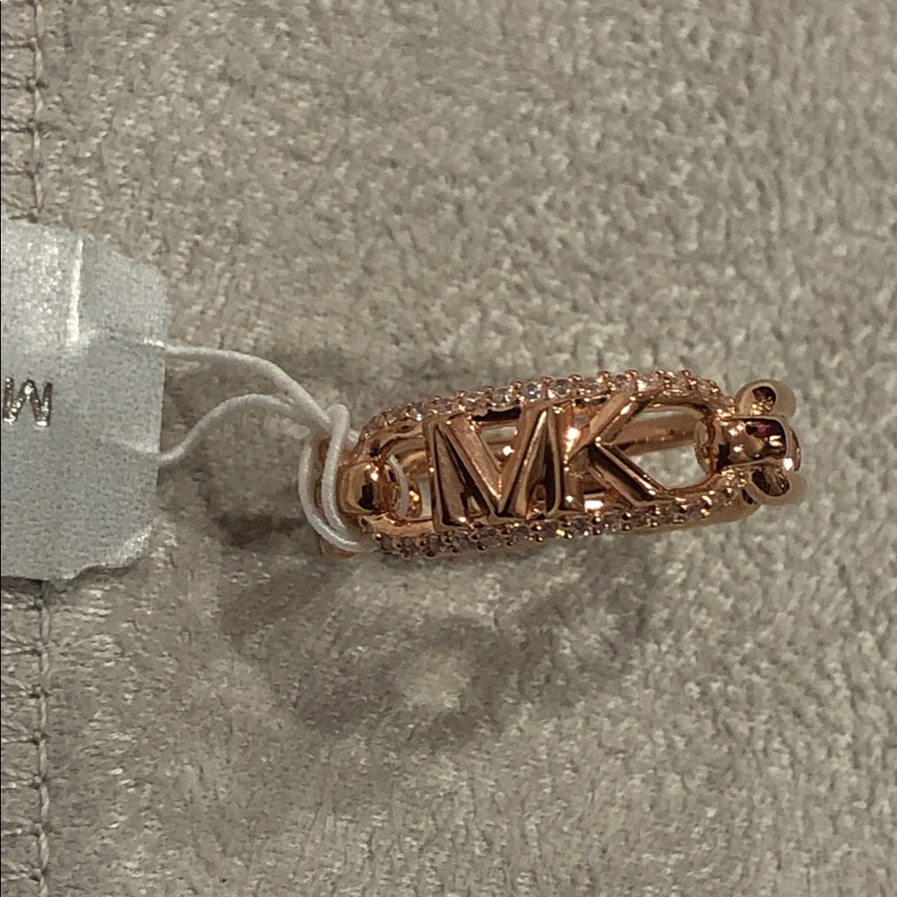 Michael Kors pink rose tint gold plated MK monogram pave interlock ring size 6